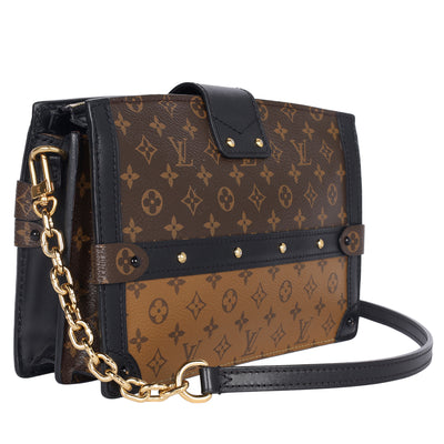 Reverse Monogram Trunk Clutch