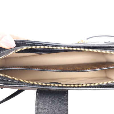 Reverse Monogram Trunk Clutch