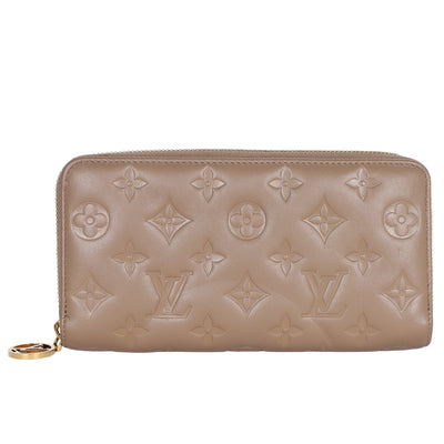 Lambskin Embossed Monogram Coussin Zippy Wallet Taupe