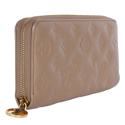 Lambskin Embossed Monogram Coussin Zippy Wallet Taupe