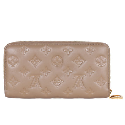 Lambskin Embossed Monogram Coussin Zippy Wallet Taupe