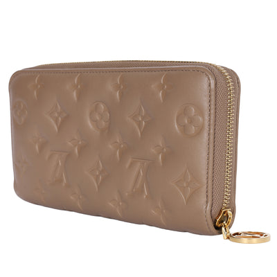 Lambskin Embossed Monogram Coussin Zippy Wallet Taupe