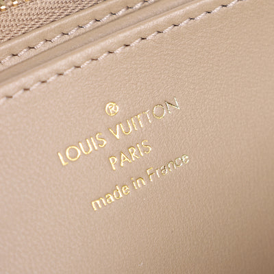 Lambskin Embossed Monogram Coussin Zippy Wallet Taupe