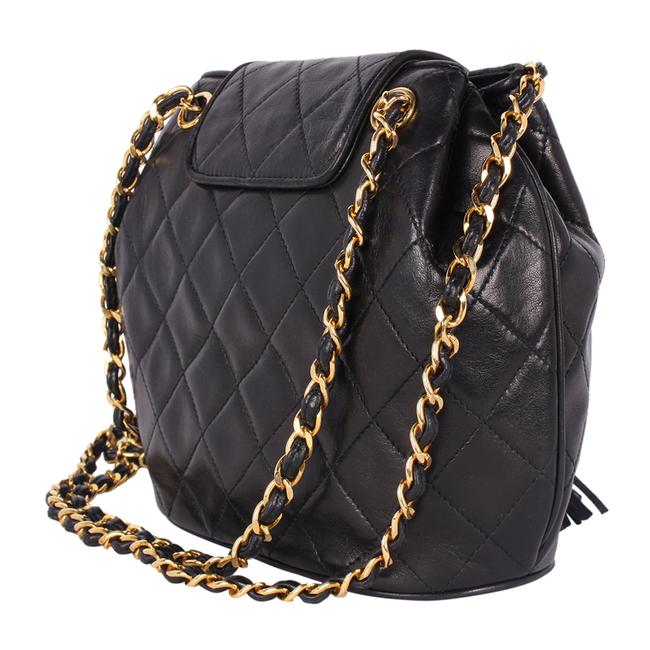 chanel bag with black chain necklace